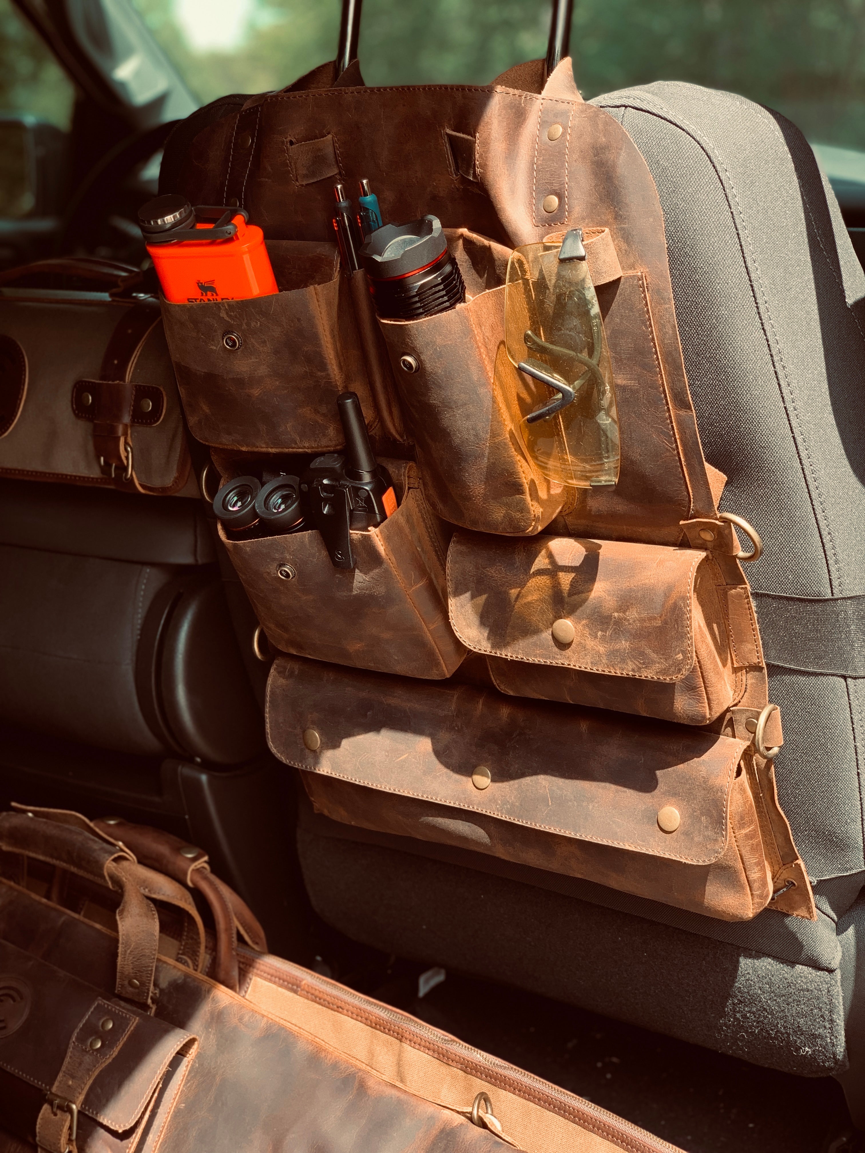 Hunter’s leather car seat organizer. - CLEAN TRIGGER